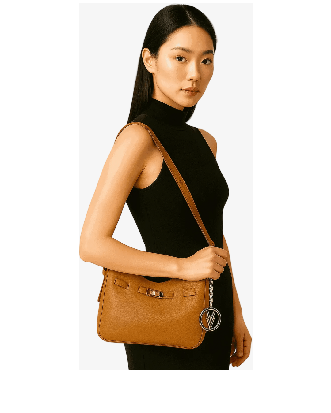 Woman holding a brown leather handbag against a white background
