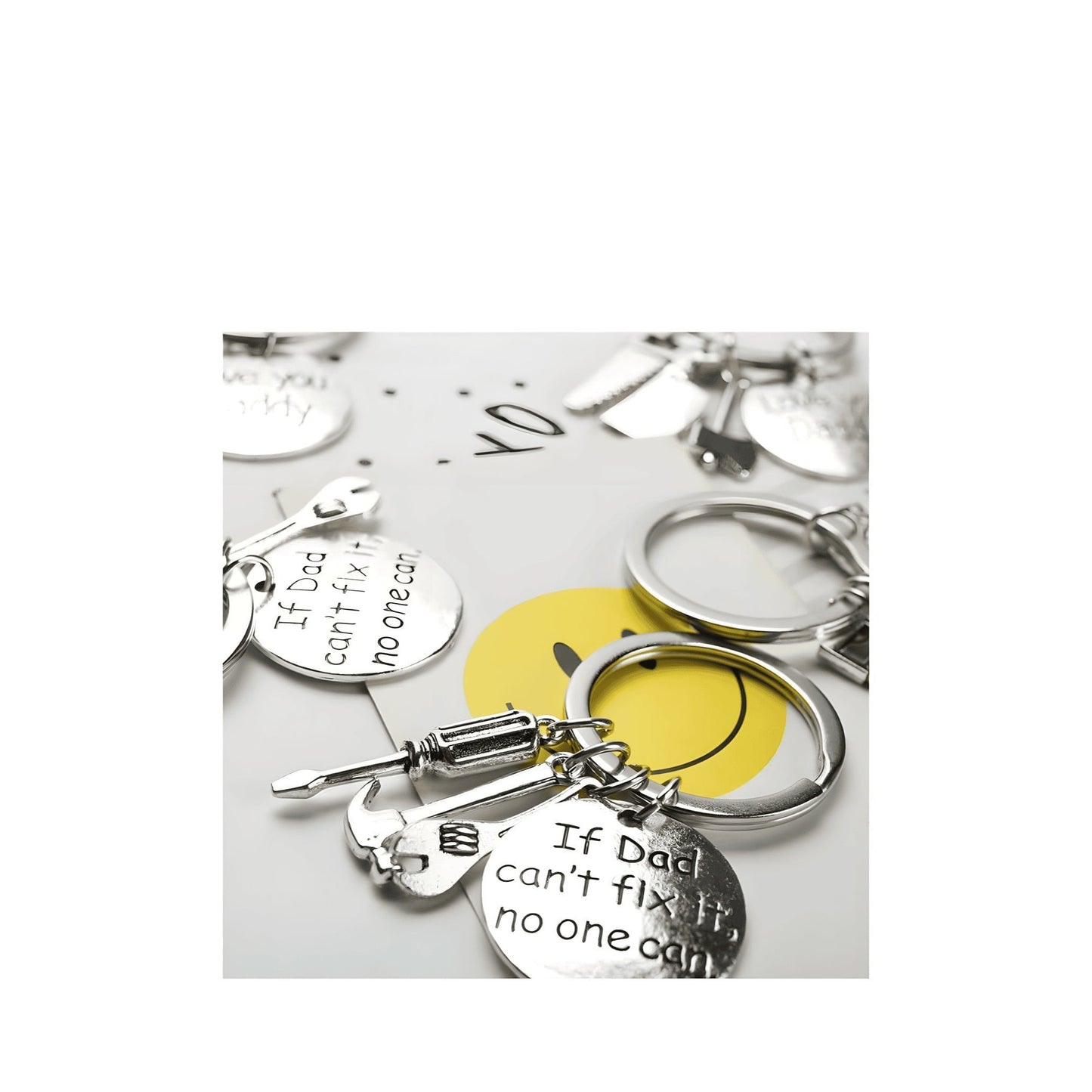 Silver keychains with tools and engraved discs stating "If Dad can't fix it, no one can."